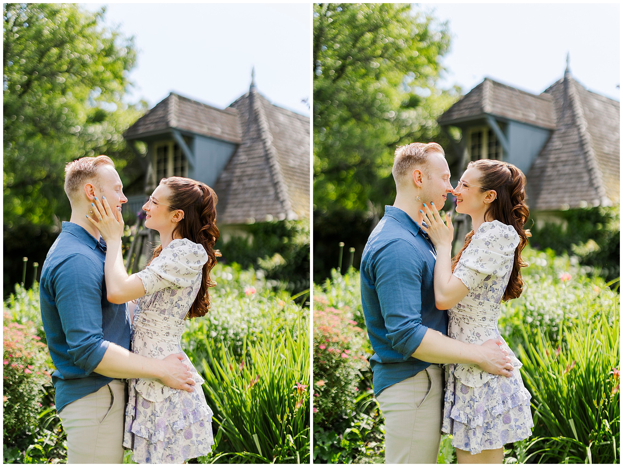 A couple stands close together outdoors, smiling and touching each other's faces lovingly. Lush greenery and a quaint wooden building in the background evoke the charm of engagement pictures at Stonecrop Gardens on a sunny day.