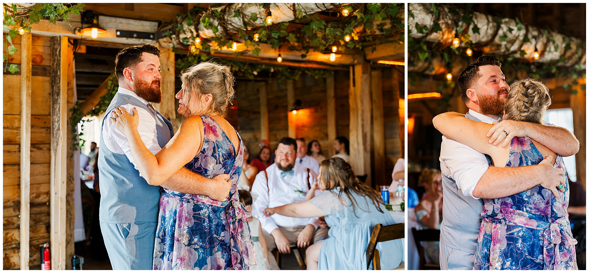 A man in a light gray vest and a woman in a floral dress share a dance at a rustic indoor celebration at Knotting Hill Farm, surrounded by guests sitting at wooden tables under greenery and warm string lights.