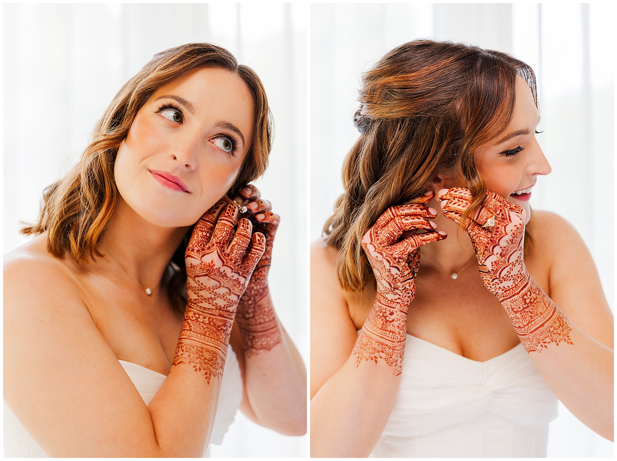 A bride with henna-decorated hands smiles while putting on earrings in this beautiful roundhouse wedding photo. She wears a strapless white dress and has shoulder-length hair, with a softly lit, white background enhancing the elegance of the moment.
