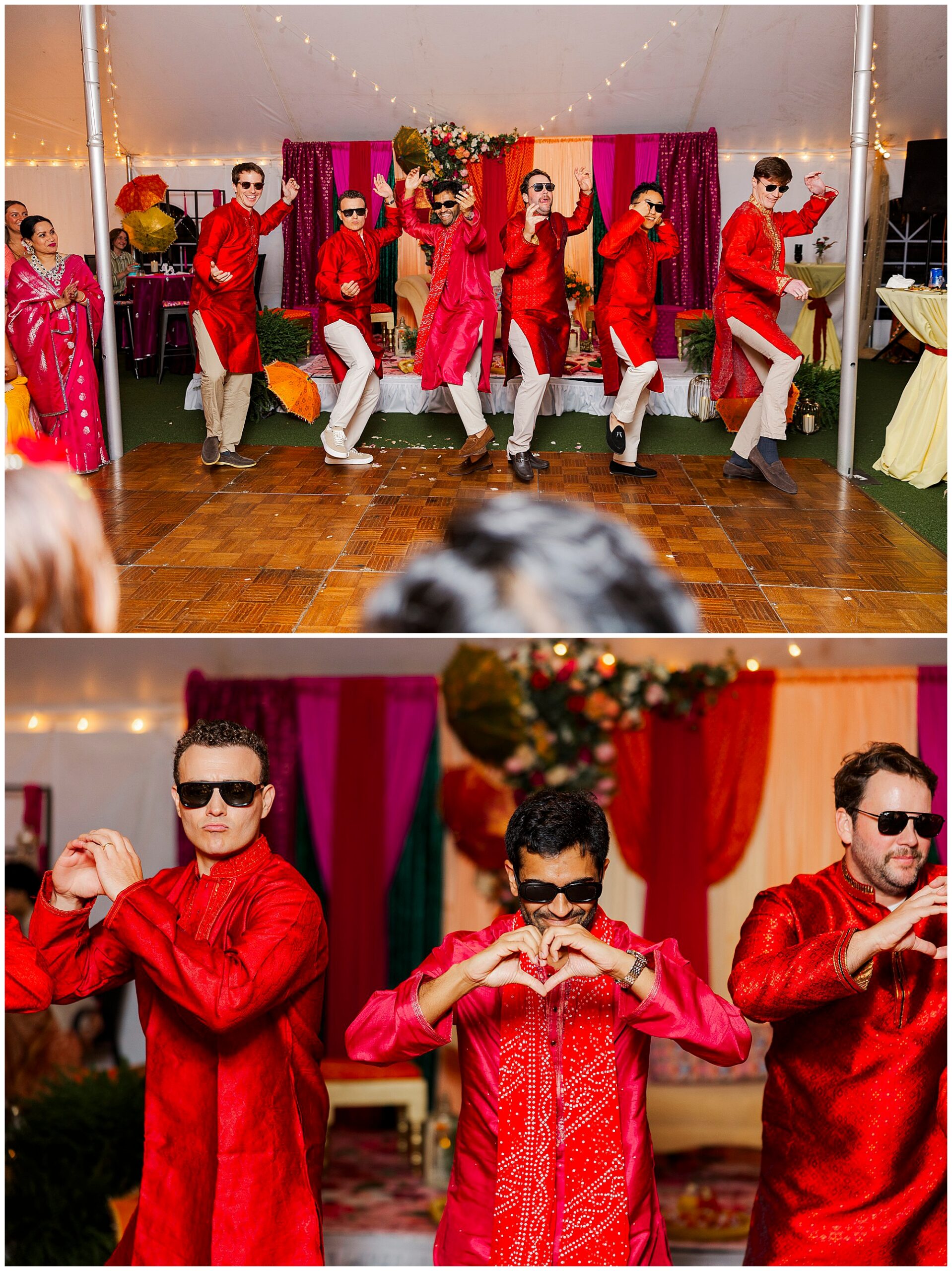 Men in bright red traditional outfits and sunglasses perform a lively dance in front of colorful drapes.