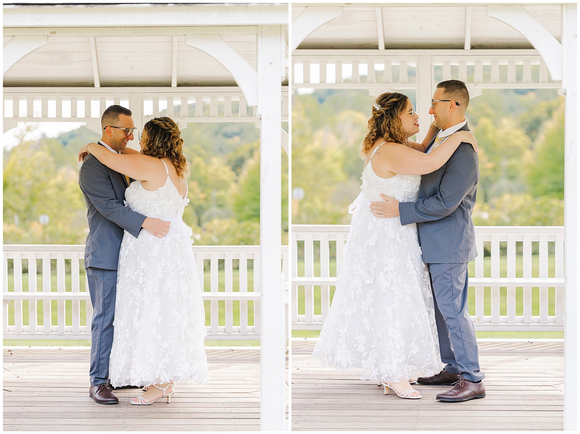 Bride in a white lace dress and groom in a gray suit embrace under the white gazebo, gazing at each other and smiling.