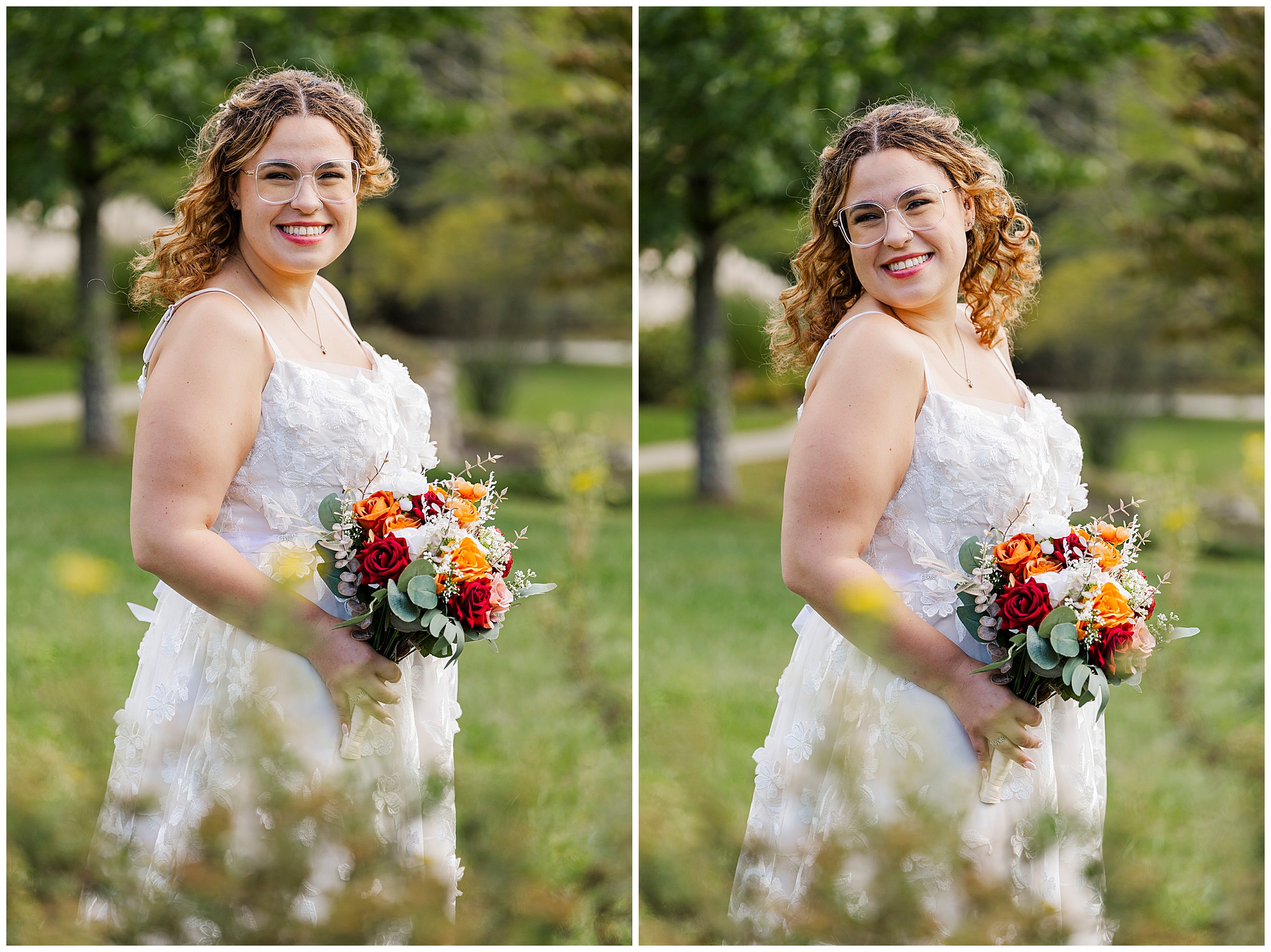 Smiling bride holds her colorful bouquet on the grass with trees behind her.