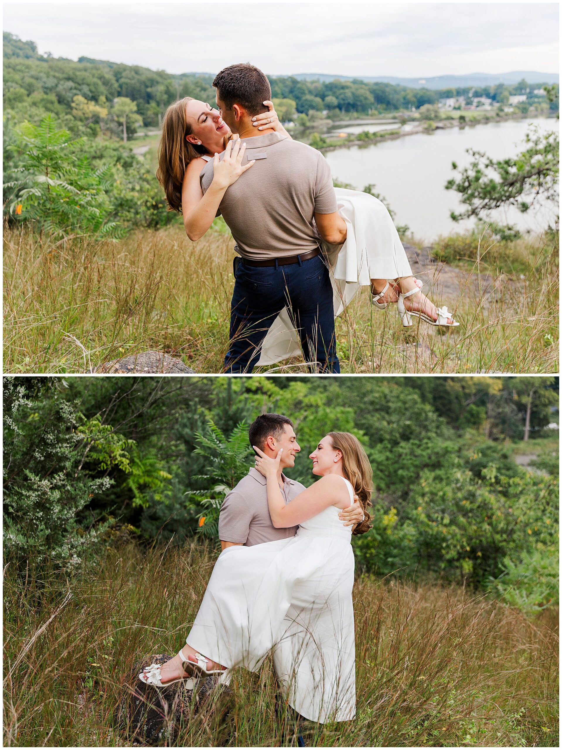 Man lifts a woman in a white dress near the tall grass, both smiling, surrounded by green trees and hills.