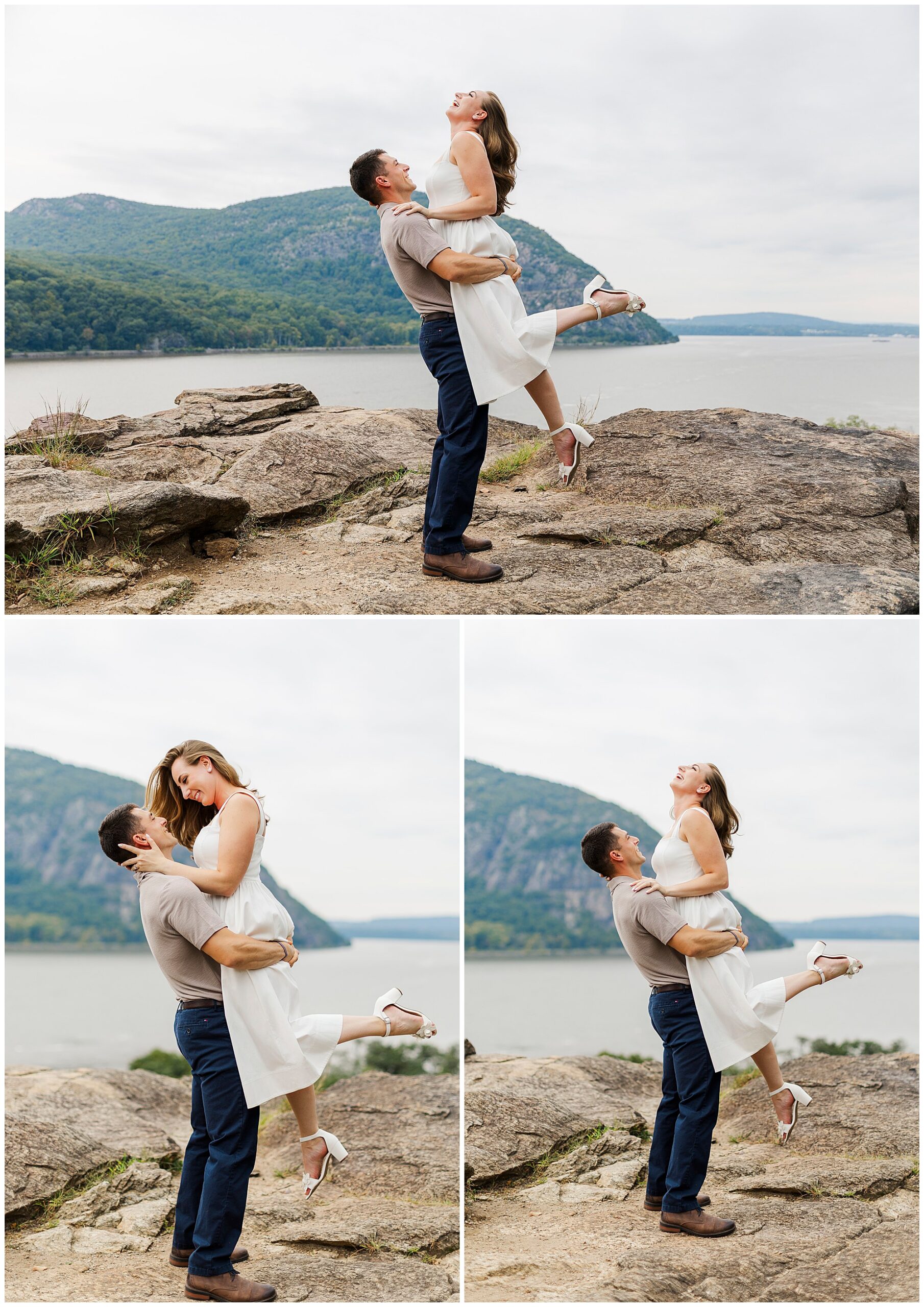 Man lifts a woman in a white dress as they smile on the rocks, with green hills behind them.