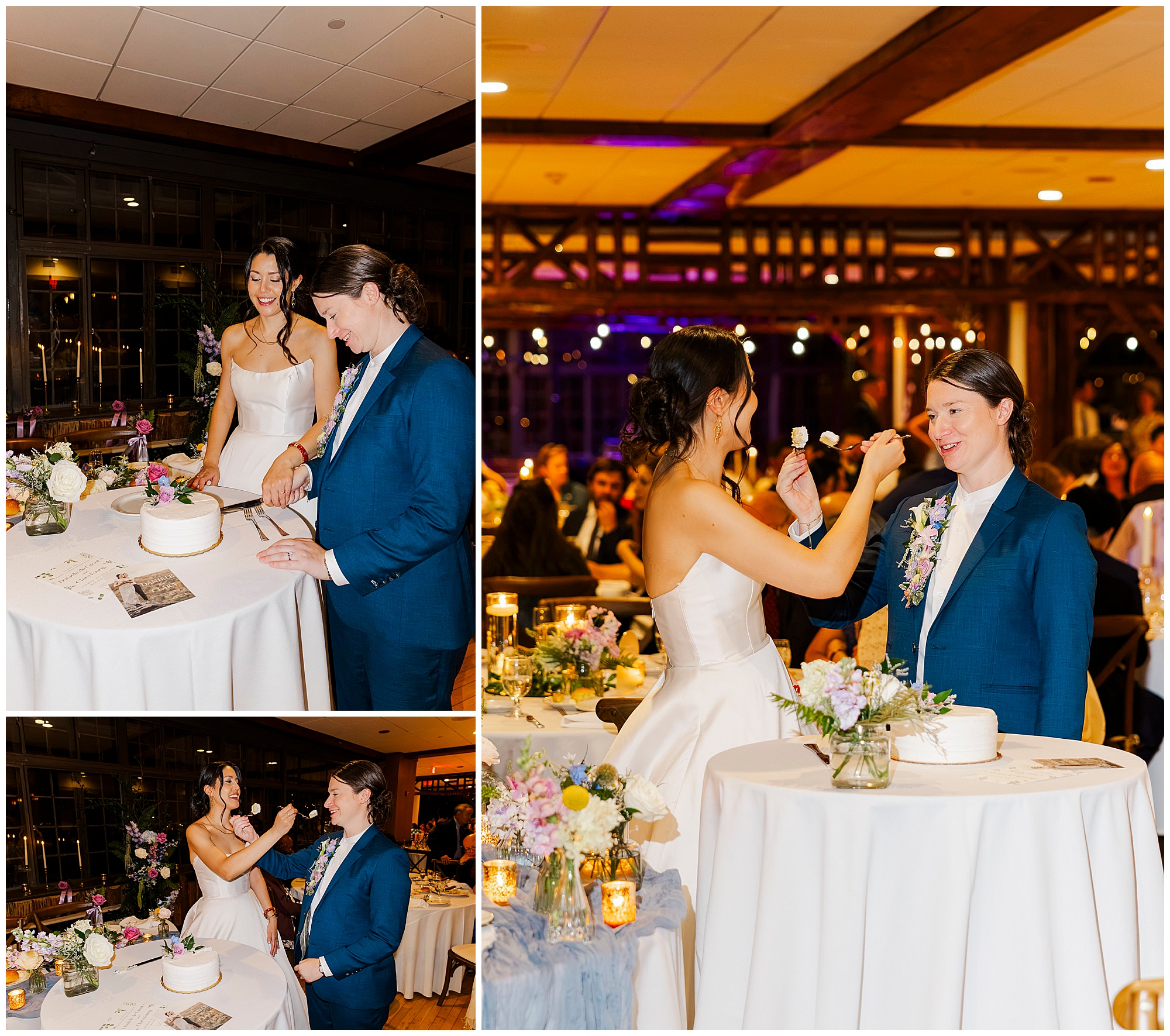 Newlyweds cut their wedding cake and feed each other a piece, laughing in a warmly lit room with flowers and candles.