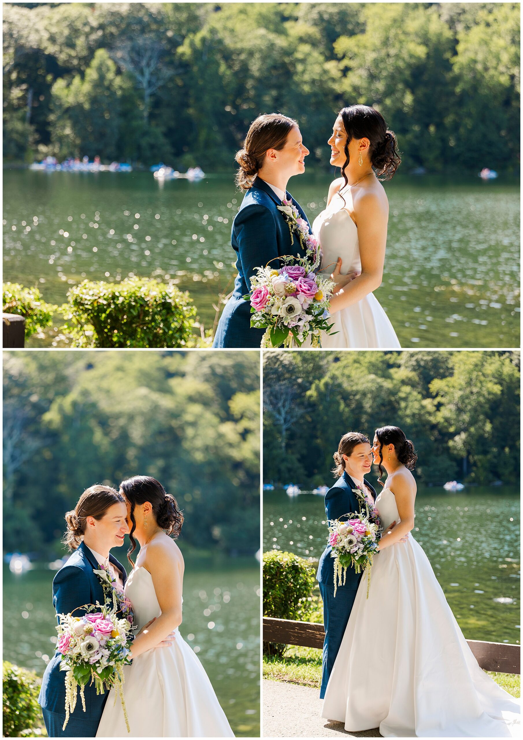 Two brides stand together by the lake, holding a bouquet and smiling at each other in the sunlight.