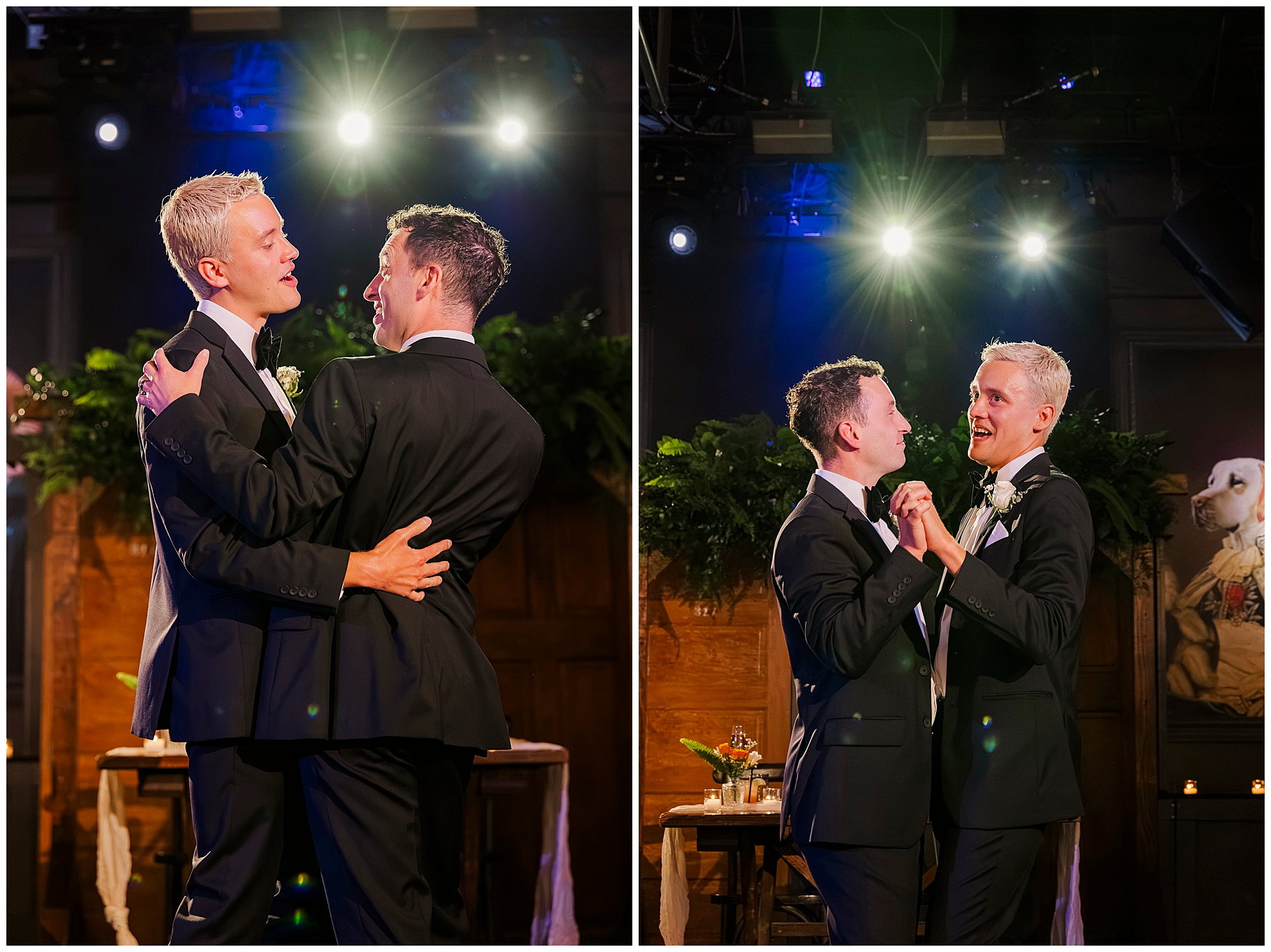 Two men in suits share a joyful dance together under bright overhead lights, with greenery and elegant wedding décor in the background—capturing the vibrant spirit of their Porta Asbury Park wedding.