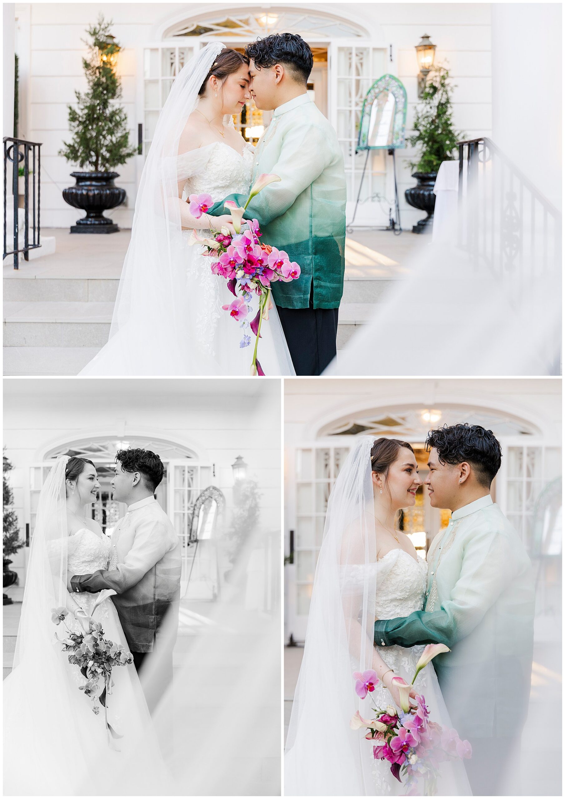 Smiling bride in a white gown and veil and groom in a green barong stand close outside a white building, holding a bouquet of pink orchids.
