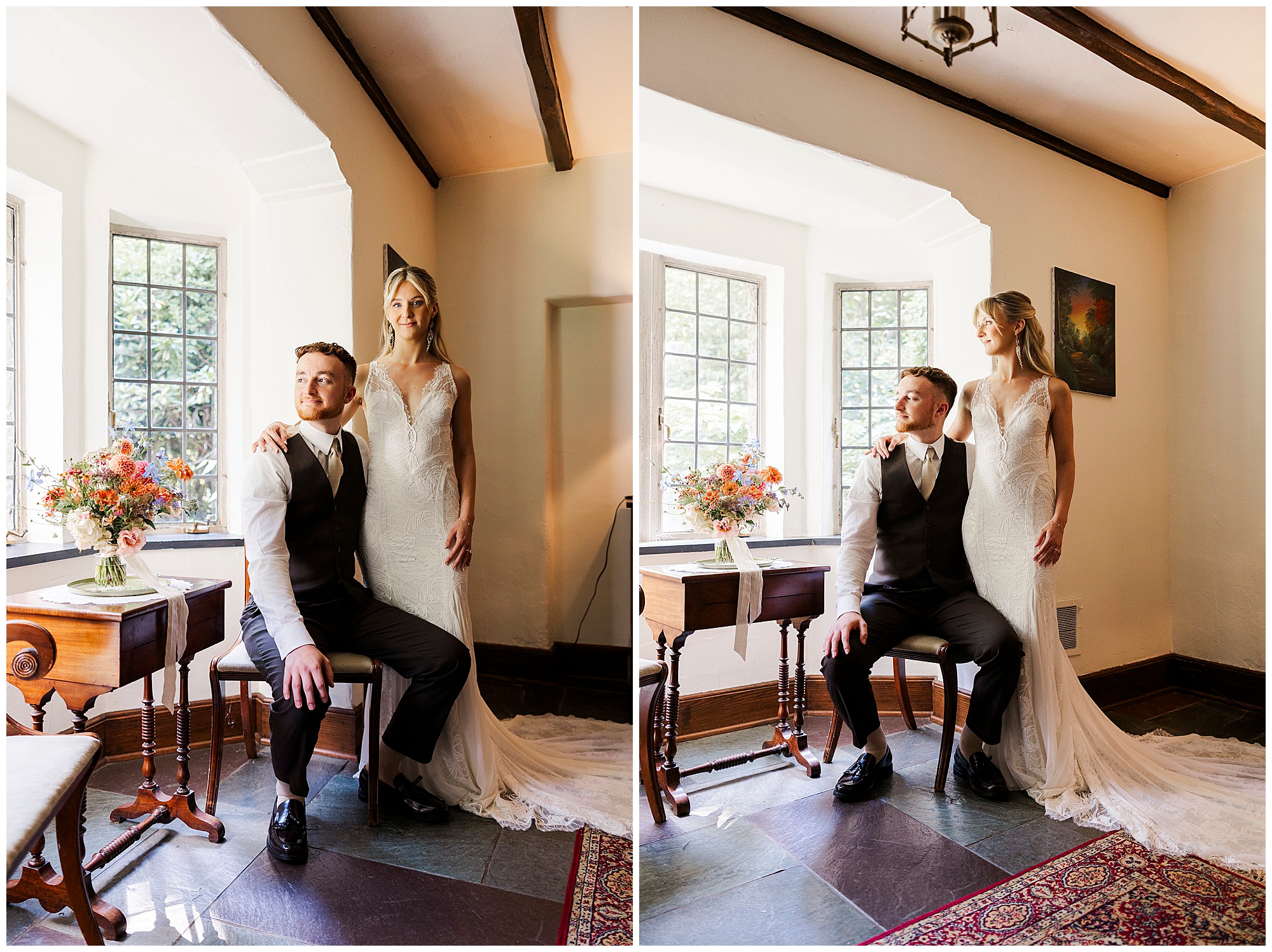 Bride stands beside the seated groom by a sunlit window, with flowers on a wooden table.
