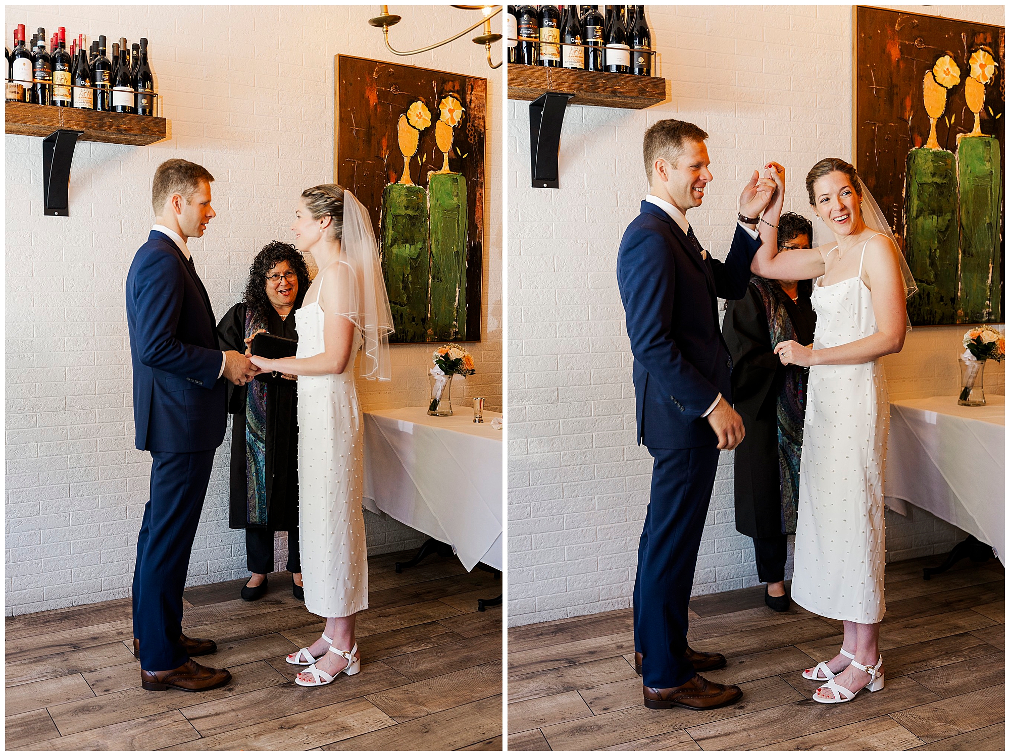 A bride and groom exchanging vows and celebrating indoors at Cafe Alaia, with an officiant standing behind them. They smile, holding hands, in front of a white brick wall with floral paintings and shelves of wine—a perfect setting for their intimate micro-wedding.