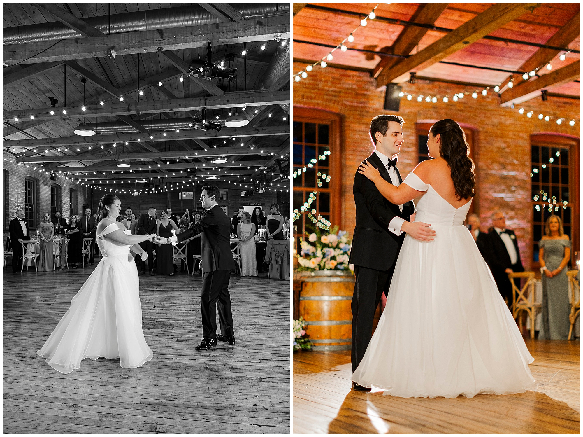 A bride and groom share their first dance in a warmly lit venue with wooden beams, string lights, and guests watching in the background.