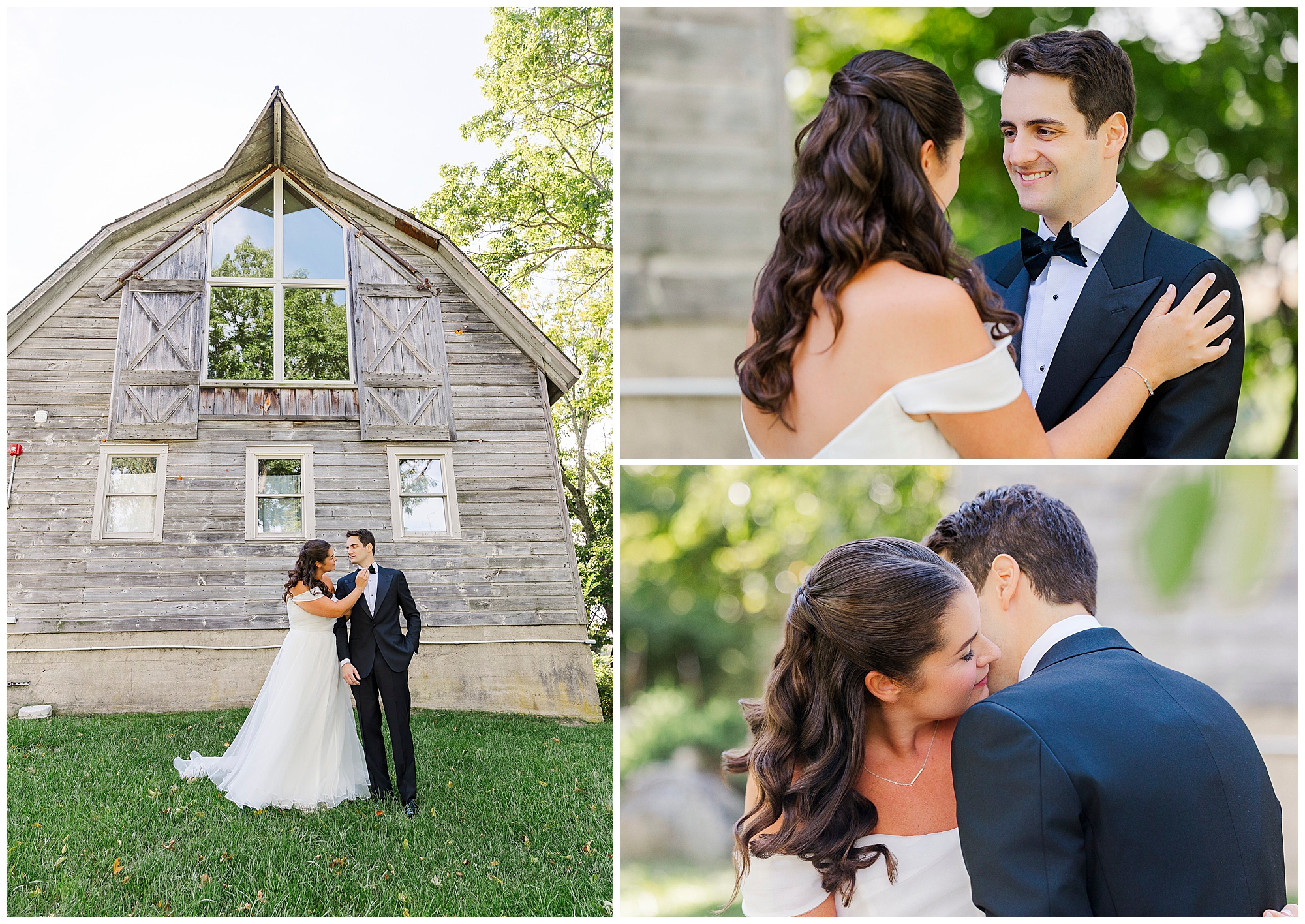 Bride and groom in formal attire embrace and smile outside a rustic wooden barn, surrounded by greenery and sunlight, on their wedding day.