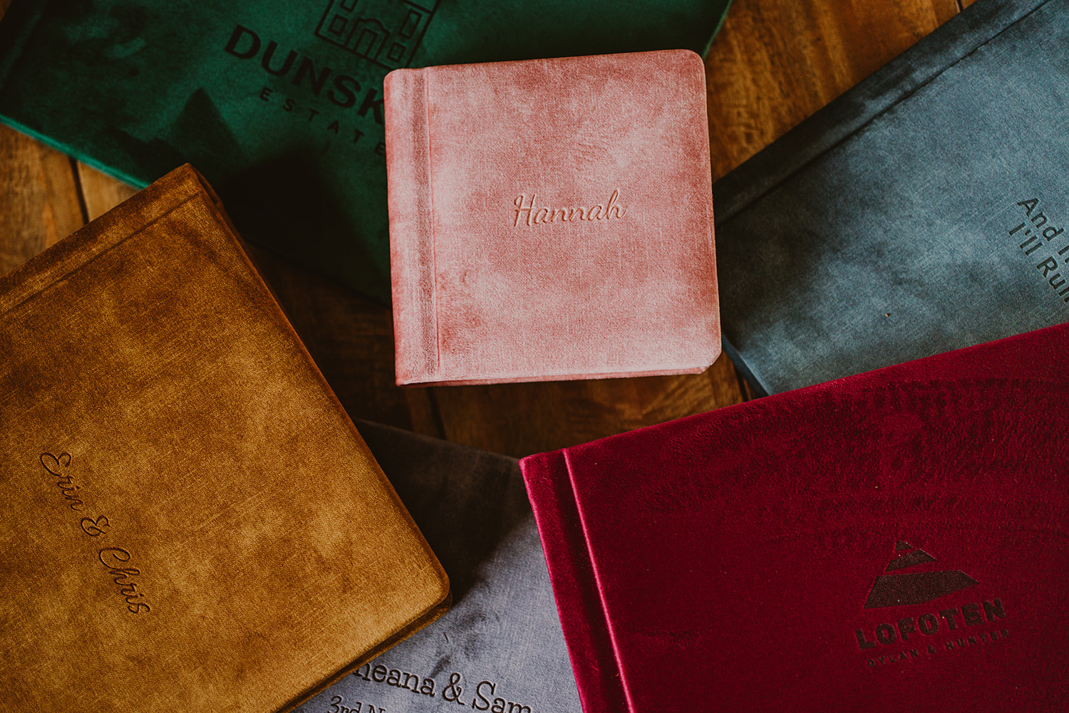 Wedding albums in a range of cover colours and sizes, each with personalised engraving